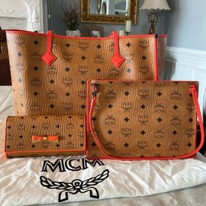 Mcm Leather tote bag with zip pouch and wallet .